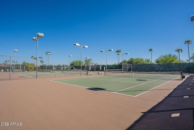 view of sport court featuring basketball hoop