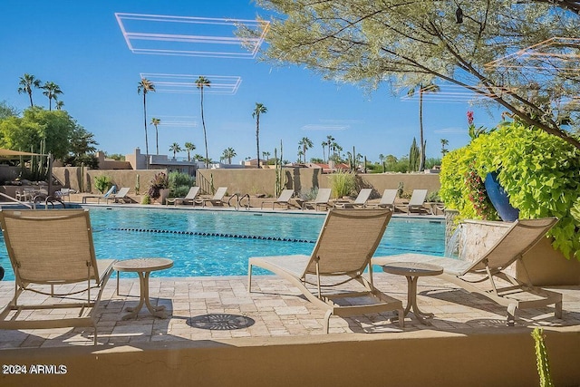 view of swimming pool featuring a patio area