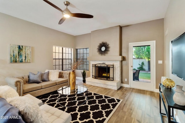 2110 W Navarro Ave, Mesa, AZ 85202 - living area featuring ceiling fan, wood finished floors, and a fireplace with raised hearth