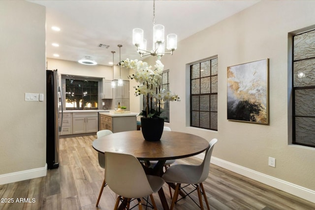 2110 W Navarro Ave, Mesa, AZ 85202 - dining space with light wood-type flooring, a chandelier, and recessed lighting