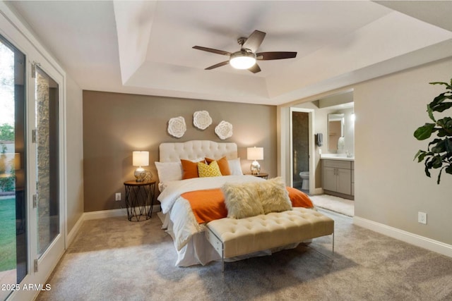 2110 W Navarro Ave, Mesa, AZ 85202 - bedroom with a tray ceiling, light carpet, connected bathroom, and ceiling fan