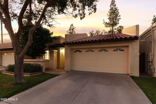 2110 W Navarro Ave, Mesa, AZ 85202 - view of front of house featuring a tile roof, stucco siding, an attached garage, and concrete driveway