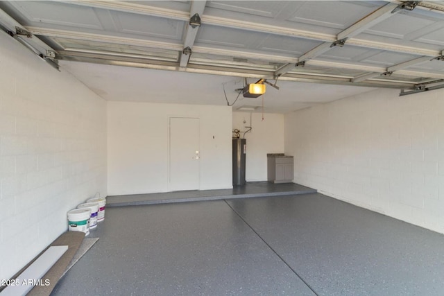 2110 W Navarro Ave, Mesa, AZ 85202 - garage featuring a garage door opener, water heater, and concrete block wall
