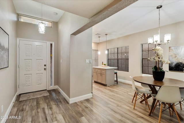 2110 W Navarro Ave, Mesa, AZ 85202 - entryway featuring a chandelier, light wood-style floors, and a towering ceiling