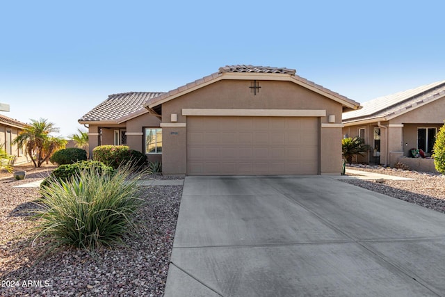 single story home with a garage