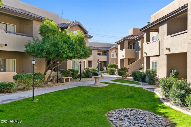 view of home's community featuring a lawn