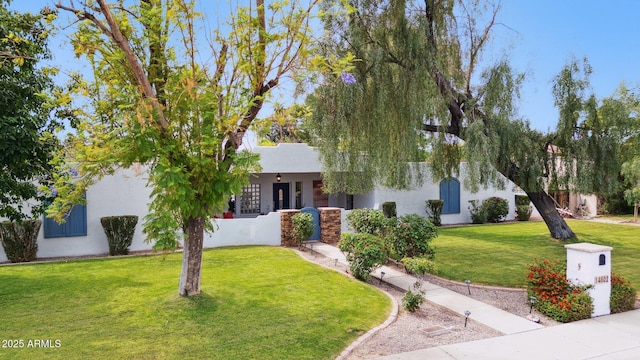 14802 N 3rd Ave, Phoenix, AZ 85023 - view of front of house featuring stucco siding and a front yard