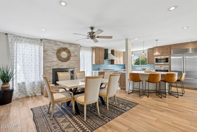 14802 N 3rd Ave, Phoenix, AZ 85023 - dining space featuring recessed lighting, a large fireplace, a ceiling fan, and light wood-type flooring