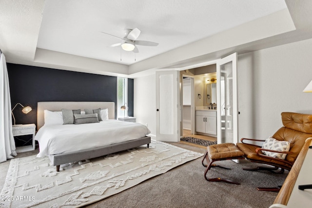 14802 N 3rd Ave, Phoenix, AZ 85023 - bedroom featuring light carpet, a sink, a raised ceiling, ensuite bath, and a ceiling fan