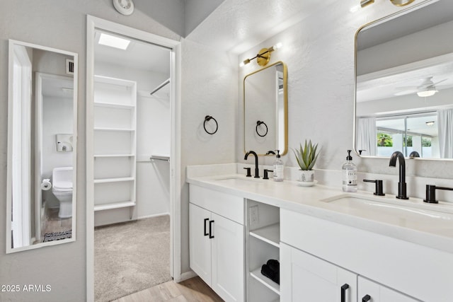 14802 N 3rd Ave, Phoenix, AZ 85023 - full bath with double vanity, a sink, a walk in closet, and a ceiling fan