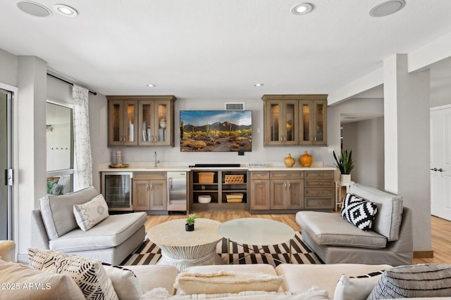 14802 N 3rd Ave, Phoenix, AZ 85023 - living room with indoor wet bar, recessed lighting, visible vents, and wine cooler