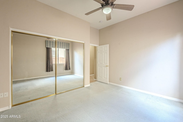 unfurnished bedroom with a closet, a ceiling fan, and baseboards