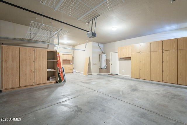 garage with water heater and a garage door opener