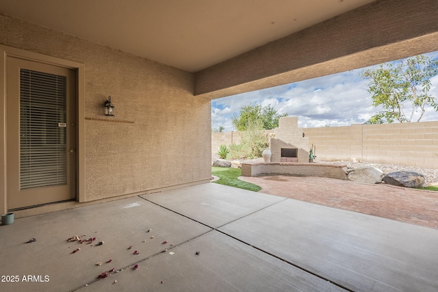 view of patio featuring fence