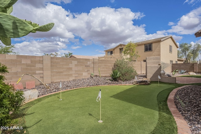 view of yard with a fenced backyard