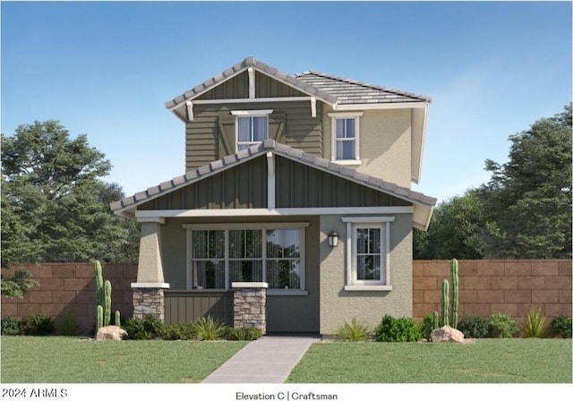 craftsman-style house with board and batten siding, a tile roof, a front yard, and fence