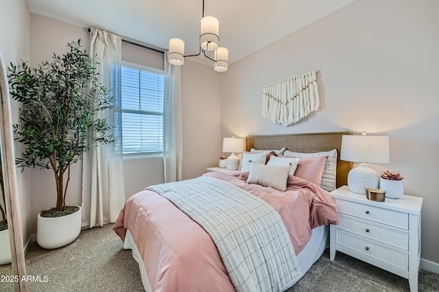 bedroom featuring baseboards, a notable chandelier, and carpet flooring