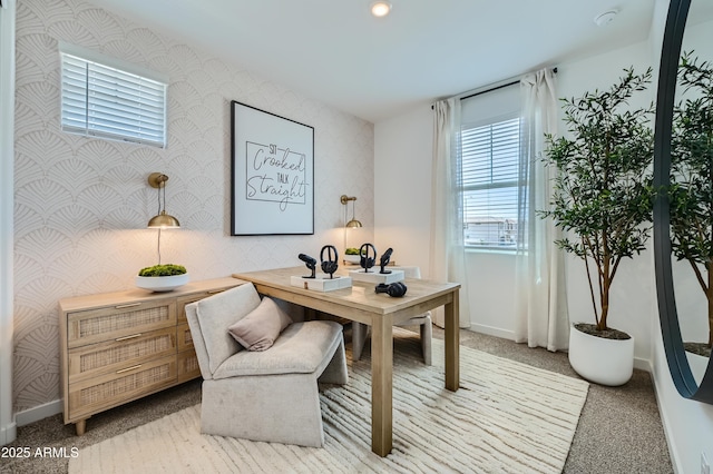 home office with wallpapered walls, light colored carpet, and baseboards