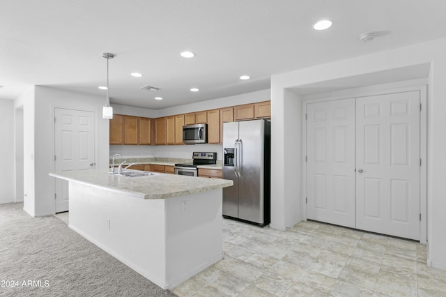 kitchen with light carpet, hanging light fixtures, sink, an island with sink, and appliances with stainless steel finishes