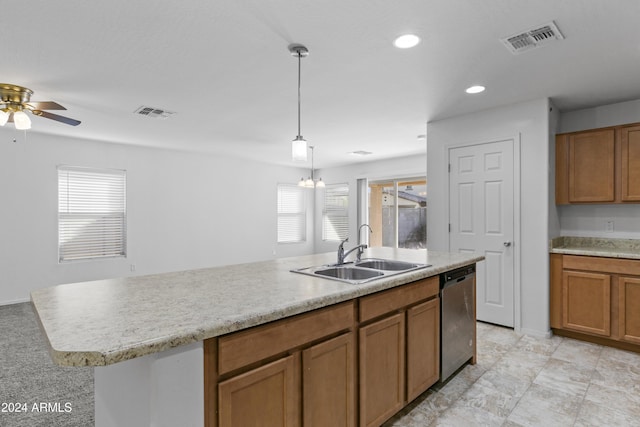 kitchen with stainless steel dishwasher, ceiling fan with notable chandelier, sink, decorative light fixtures, and a center island with sink