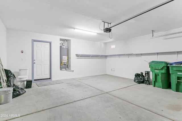 garage featuring gas water heater and a garage door opener