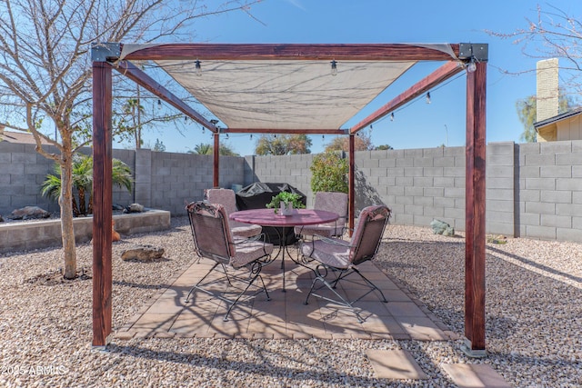 view of patio / terrace with outdoor dining space and a fenced backyard