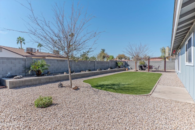 view of yard featuring a patio area and a fenced backyard