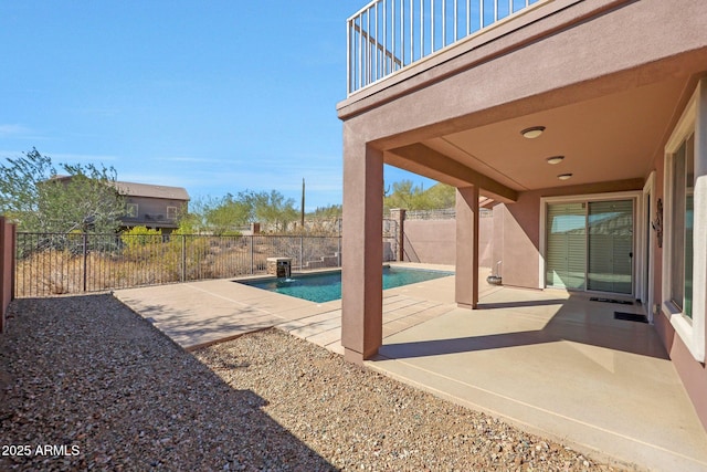 view of swimming pool with a patio area, a fenced backyard, and a fenced in pool