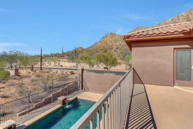 balcony featuring a mountain view