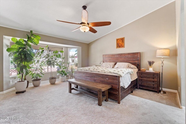 bedroom featuring baseboards, carpet, a ceiling fan, and vaulted ceiling