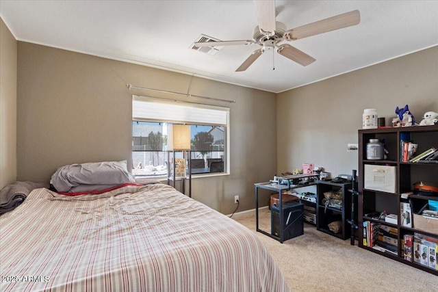 carpeted bedroom featuring visible vents and ceiling fan