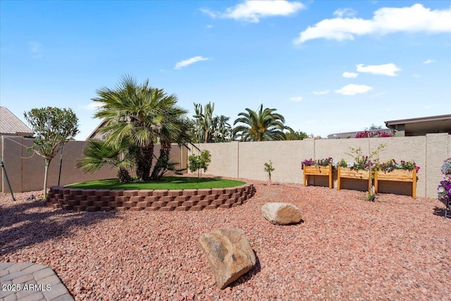 view of yard featuring a fenced backyard