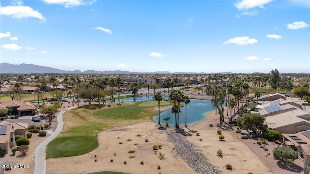 aerial view with a residential view, a water and mountain view, and view of golf course