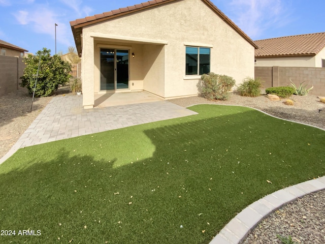 rear view of property with a patio