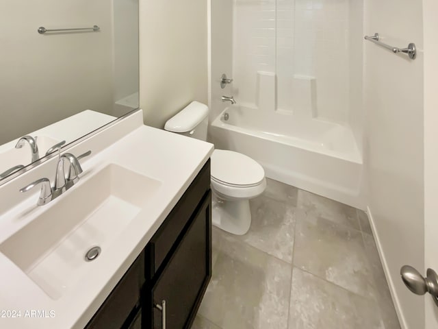 full bathroom featuring tile patterned floors, vanity, toilet, and shower / washtub combination