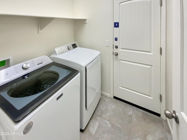 washroom with independent washer and dryer