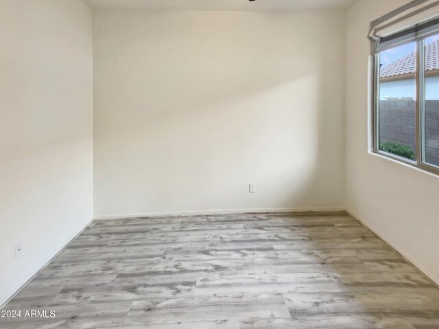 spare room with light hardwood / wood-style floors