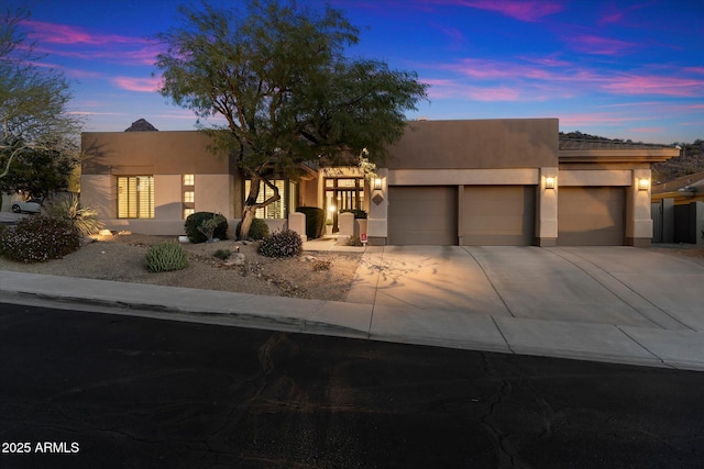 view of front of property featuring a garage