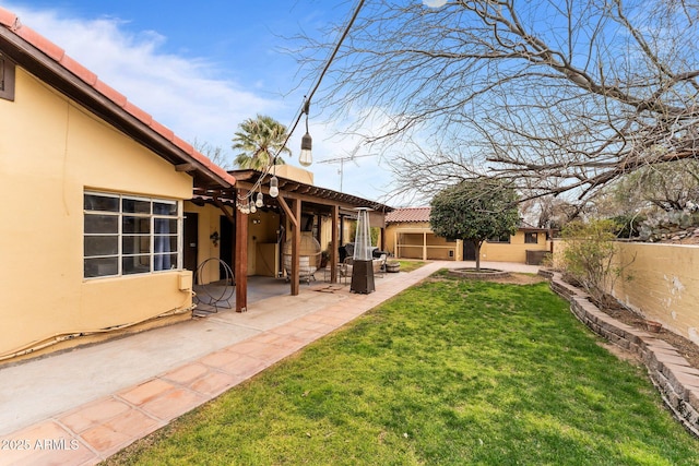 view of yard with a patio area and fence