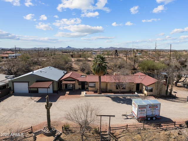 birds eye view of property featuring a mountain view