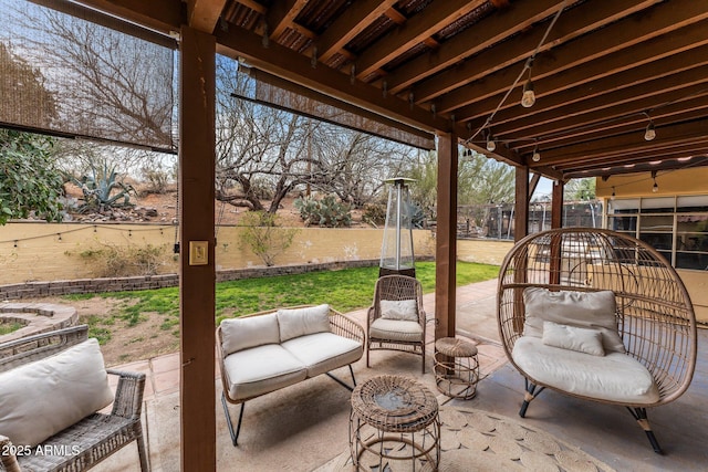 view of patio featuring an outdoor living space and fence