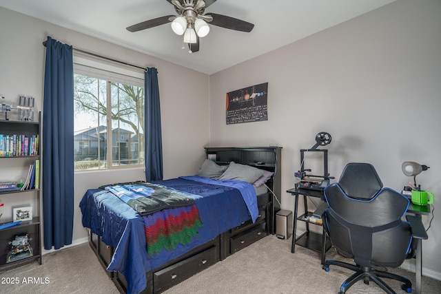 bedroom featuring ceiling fan and carpet