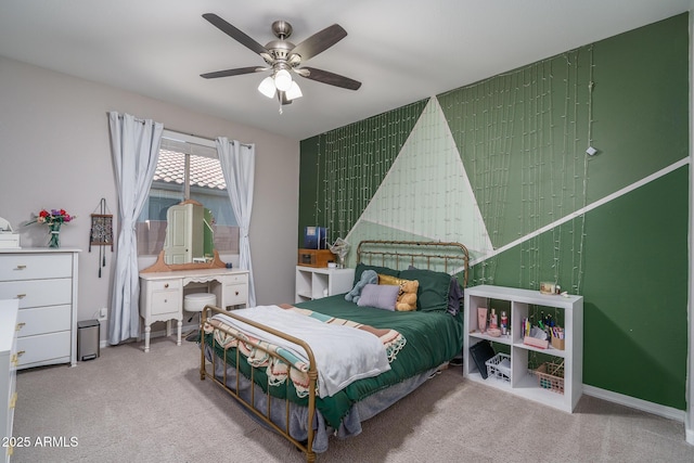 bedroom with ceiling fan and light colored carpet