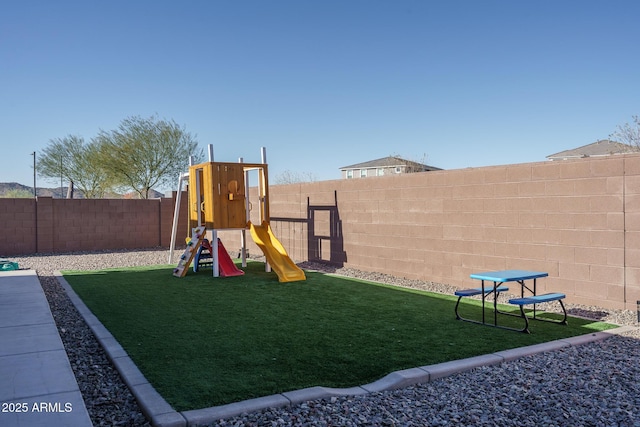 view of playground with a yard