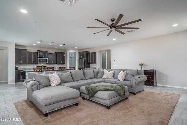 living room with ceiling fan