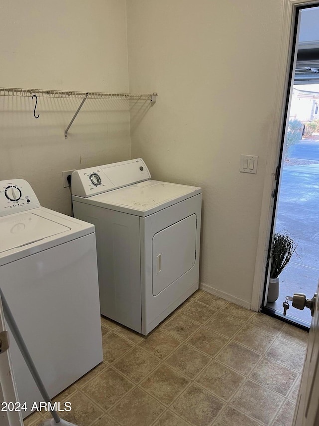 clothes washing area featuring washer and dryer