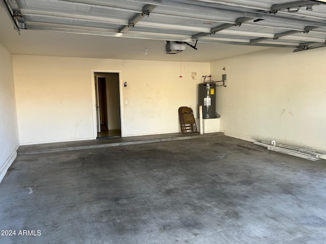 garage featuring electric water heater and a garage door opener