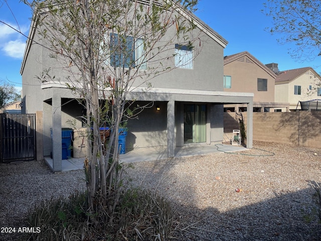 rear view of property with a patio area