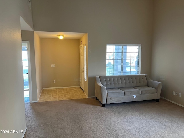 unfurnished living room featuring light carpet