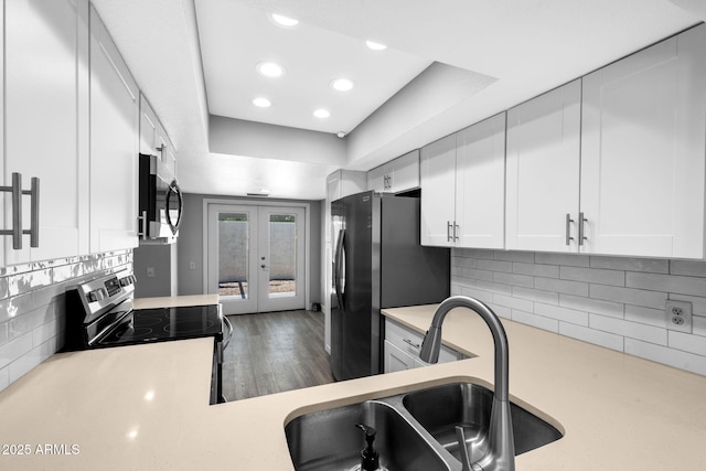 347 Leisure World, Mesa, AZ 85206 - kitchen with appliances with stainless steel finishes, a sink, light countertops, french doors, and white cabinetry